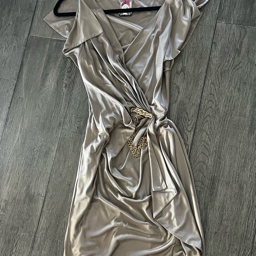 Great condition worn twice dry cleaned lined and has Gold hardware